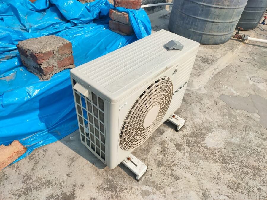 hitachi aircon outdoor unit in direct sunlight